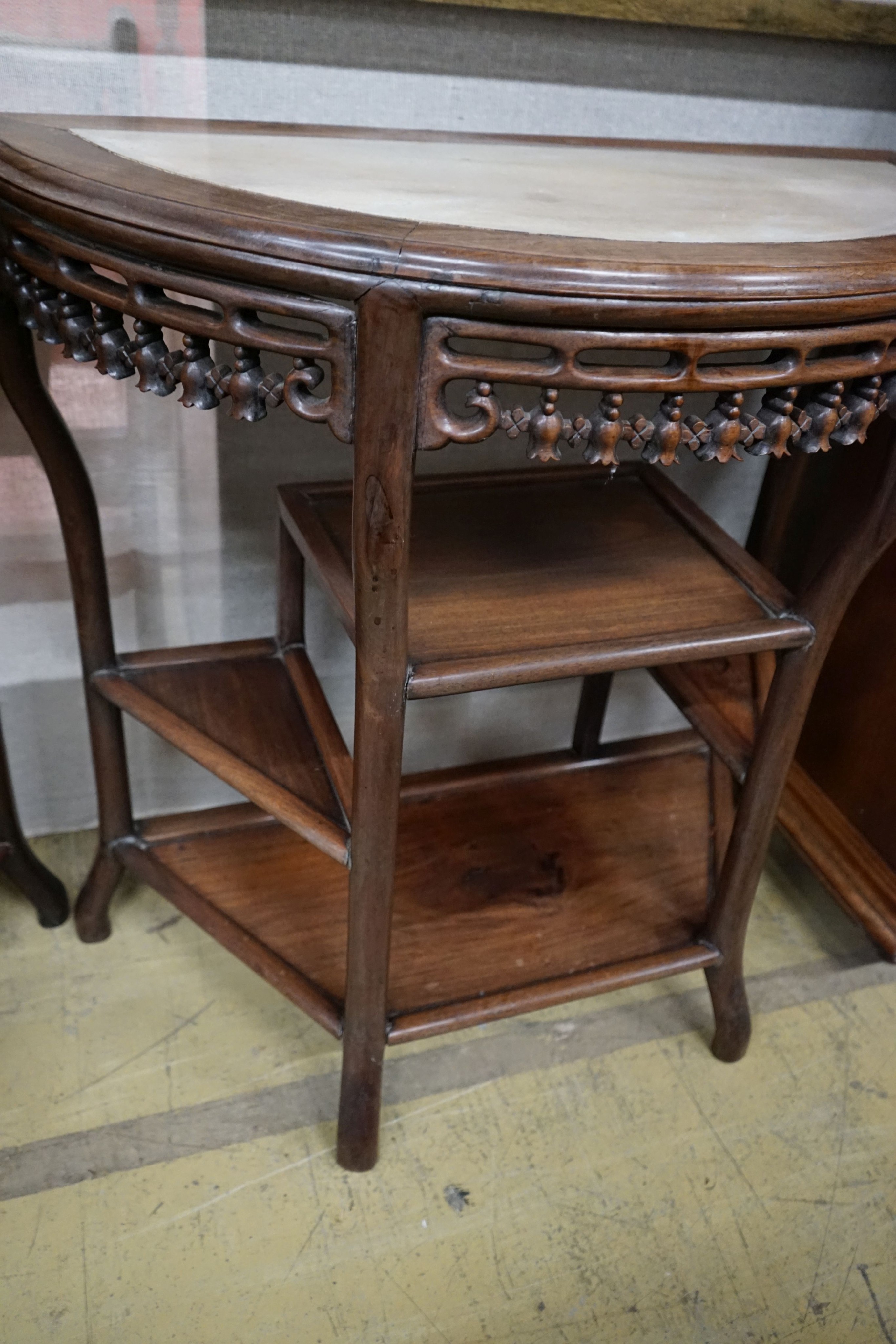 A pair of Chinese marble-topped demi lune console tables, width 82cm, depth 40cm, height 80cm